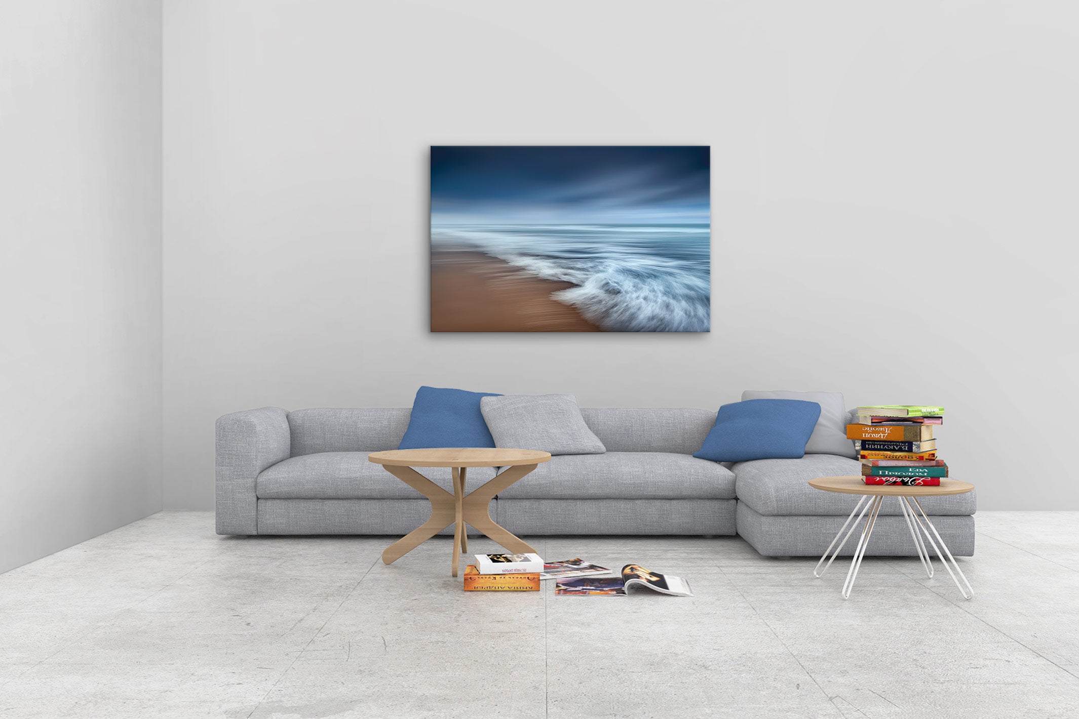 New Zealand landscape photo canvas wall art in neutral lounge setting with a grey couch, coffee tables and books